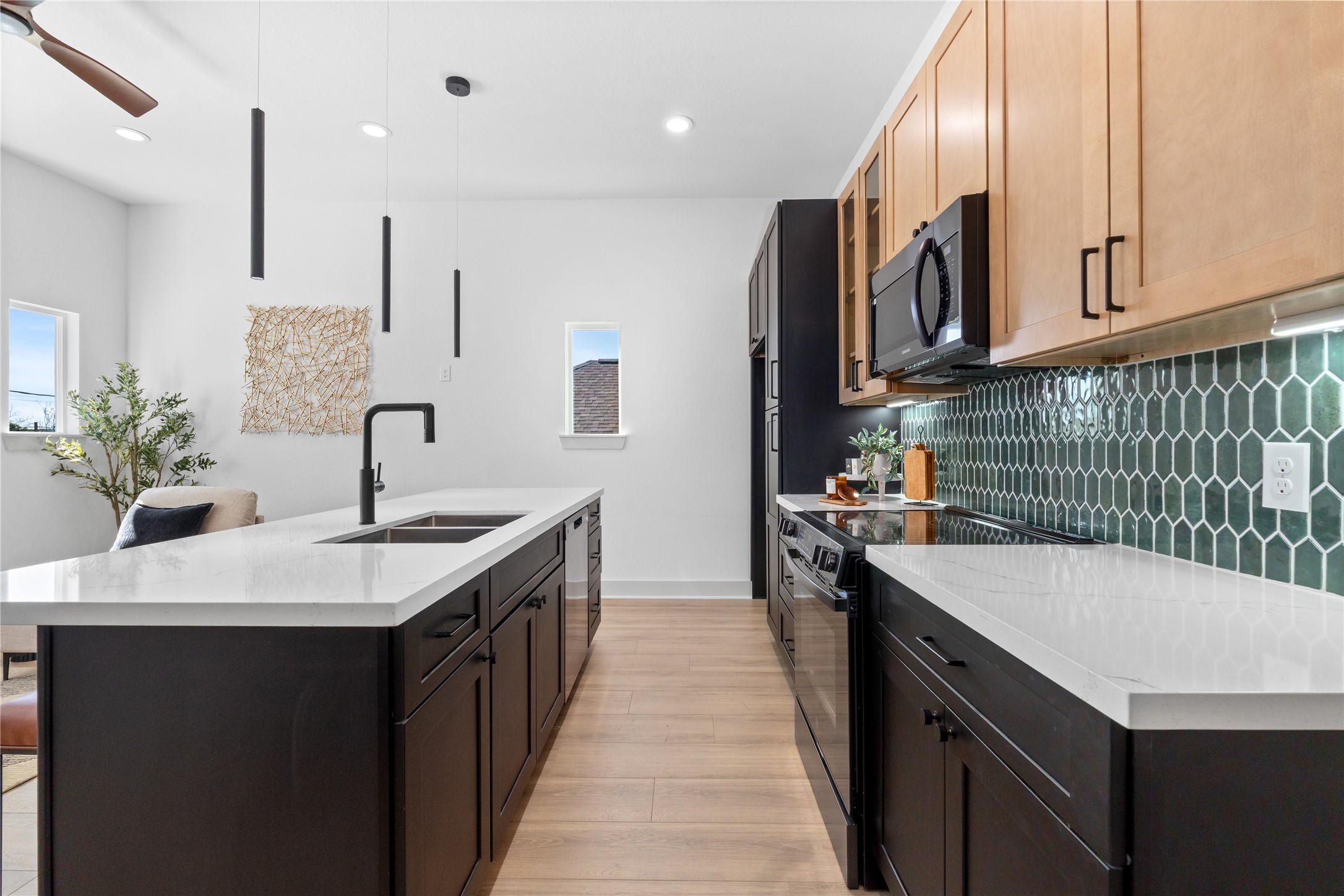 9819 Turnbow Street, Unit CD Houston, TX 77029 - Photo 8 of 32 a kitchen with a sink stove and cabinets
