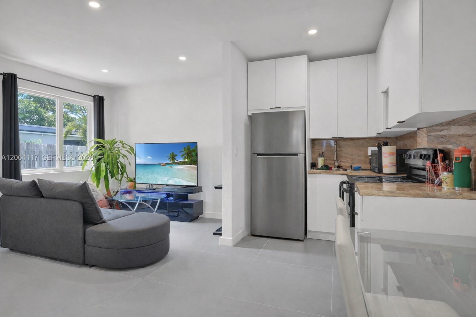 11775 Southwest 223rd Street Miami, FL 33170 - Photo 19 of 42 a living room with furniture and a couch