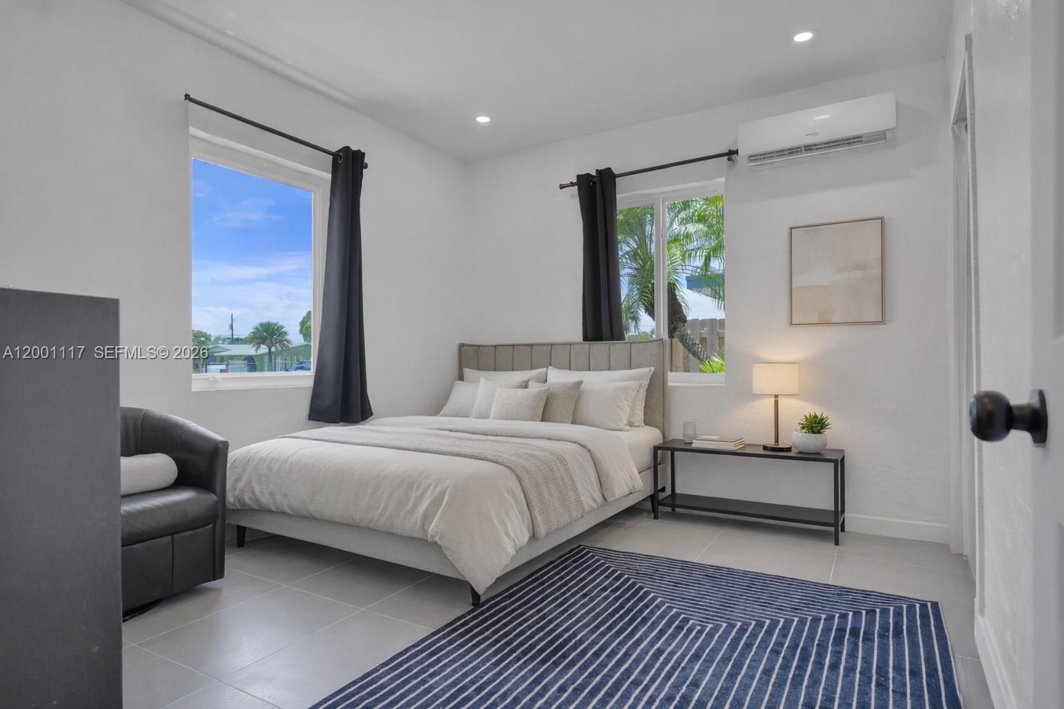 11775 Southwest 223rd Street Miami, FL 33170 - Photo 23 of 42 a bedroom with a bed and windows