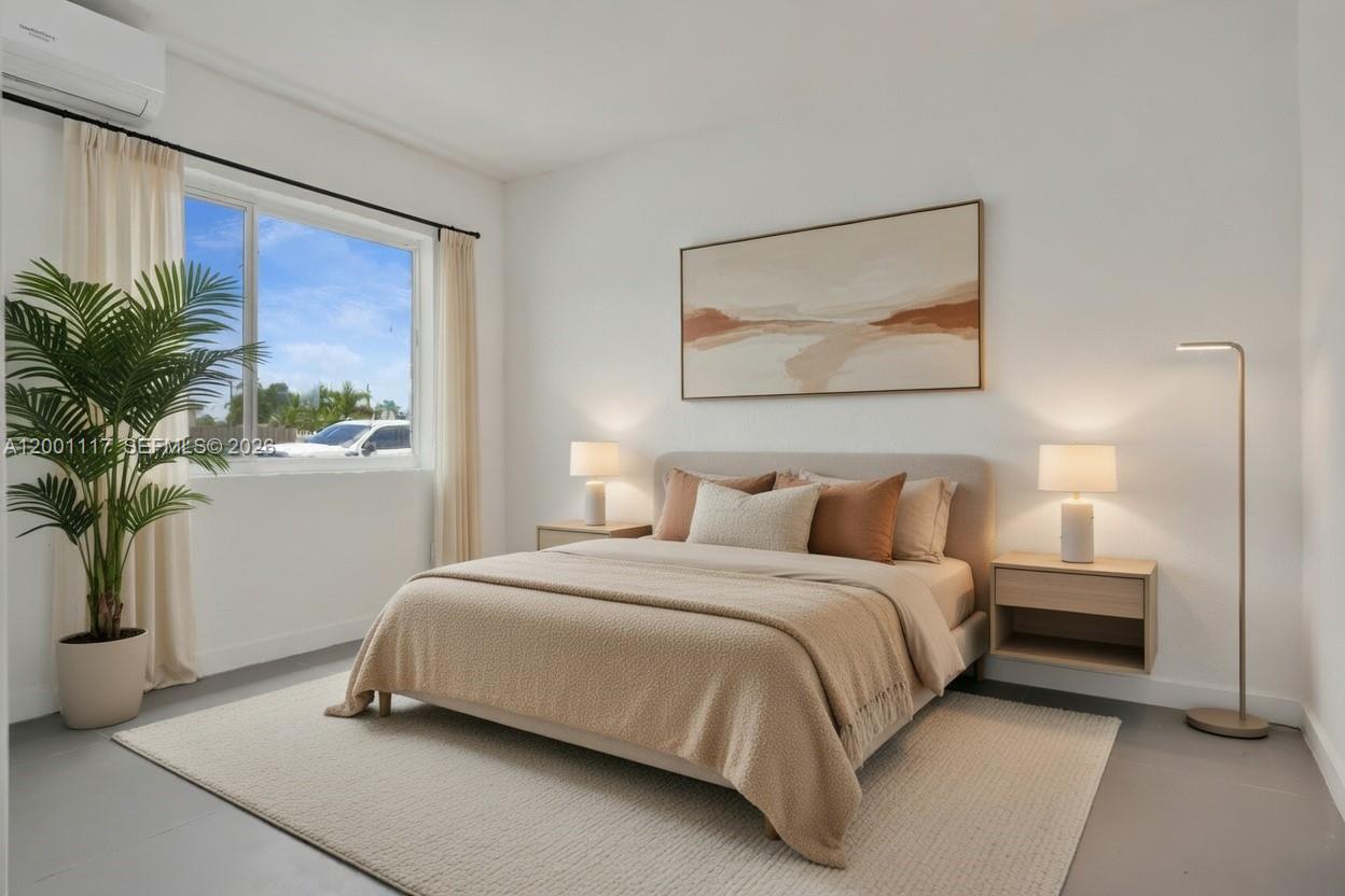 11775 Southwest 223rd Street Miami, FL 33170 - Photo 32 of 42 a bedroom with a bed and a potted plant