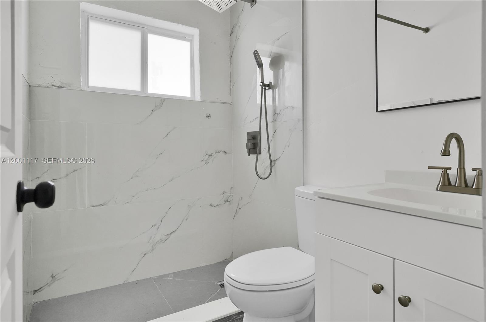 11775 Southwest 223rd Street Miami, FL 33170 - Photo 36 of 42 a bathroom with a toilet sink and shower