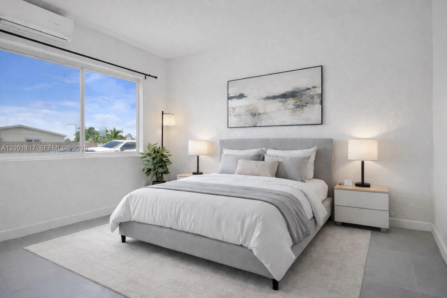 11775 Southwest 223rd Street Miami, FL 33170 - Photo 39 of 42 a bedroom with a bed lamp and window