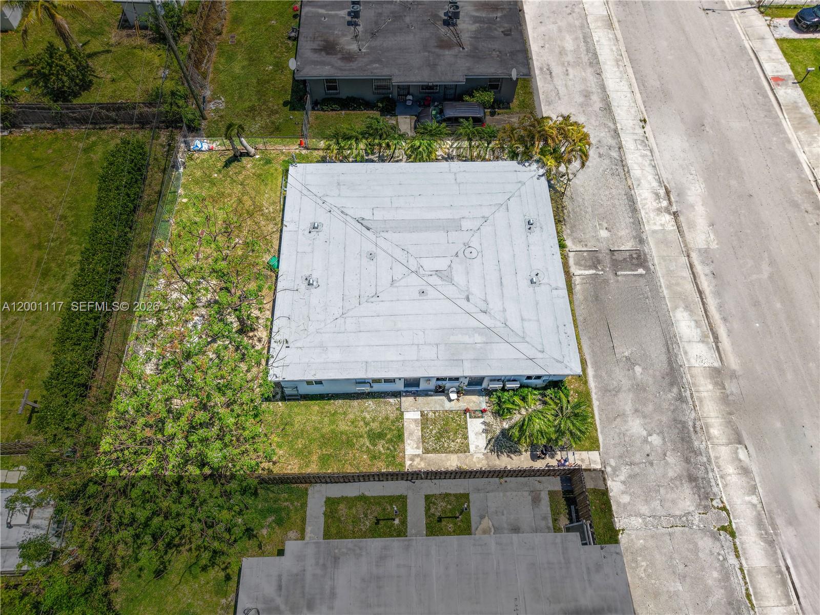 11775 Southwest 223rd Street Miami, FL 33170 - Photo 6 of 42 an aerial view of a house with a garden