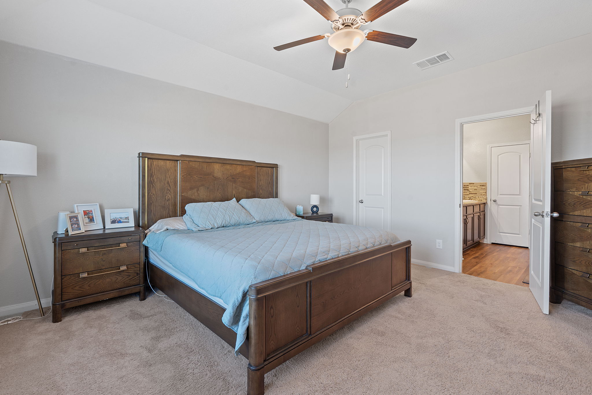 19212 Andrew Jackson Street Manor, TX 78653 - Photo 14 of 35 a bed room with a bed and a ceiling fan