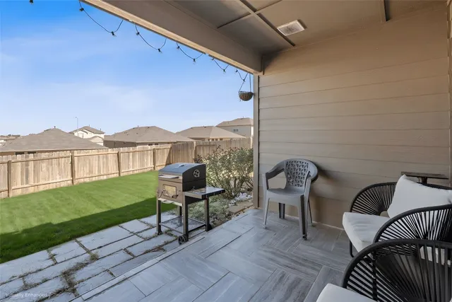 a view of a chairs and tables in the patio