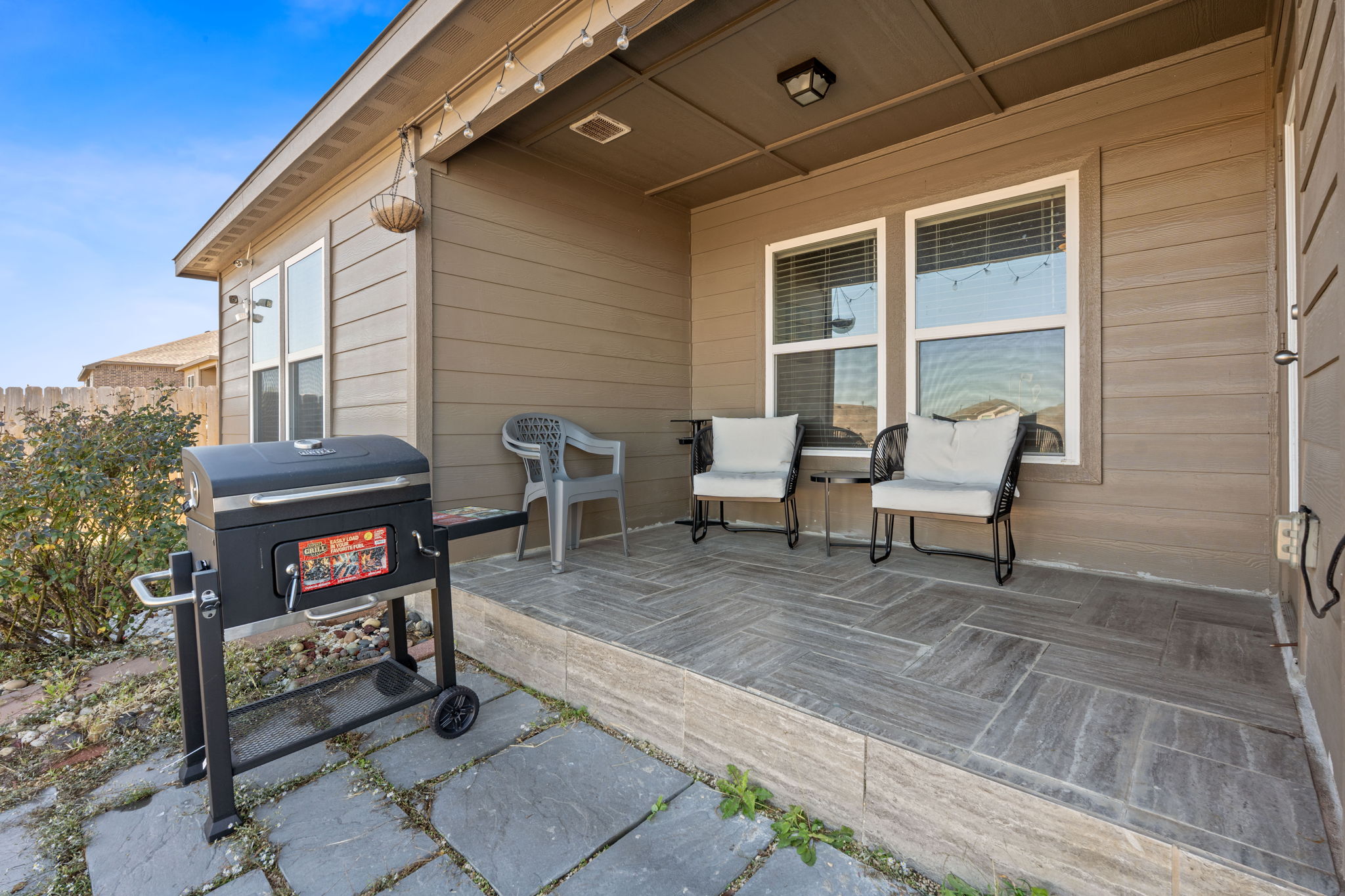 19212 Andrew Jackson Street Manor, TX 78653 - Photo 25 of 35 a view of a terrace with chairs and a table