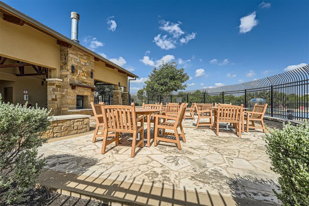19212 Andrew Jackson Street Manor, TX 78653 - Photo 33 of 35 a view of a chairs and tables in the patio
