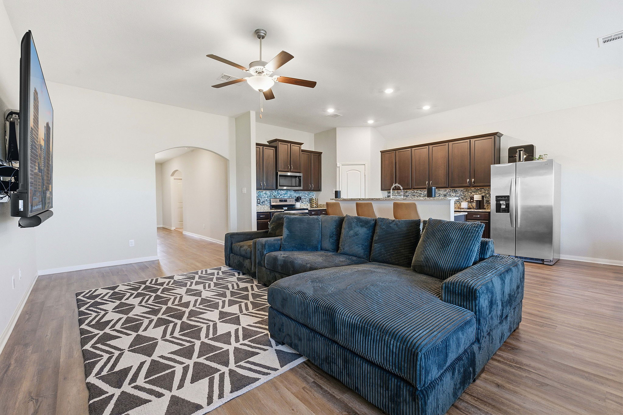 19212 Andrew Jackson Street Manor, TX 78653 - Photo 4 of 35 a living room with furniture and a flat screen tv