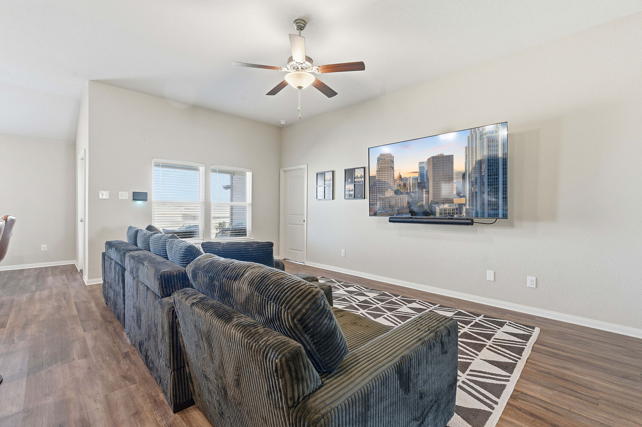 19212 Andrew Jackson Street Manor, TX 78653 - Photo 6 of 35 a living room with furniture and a wooden floor