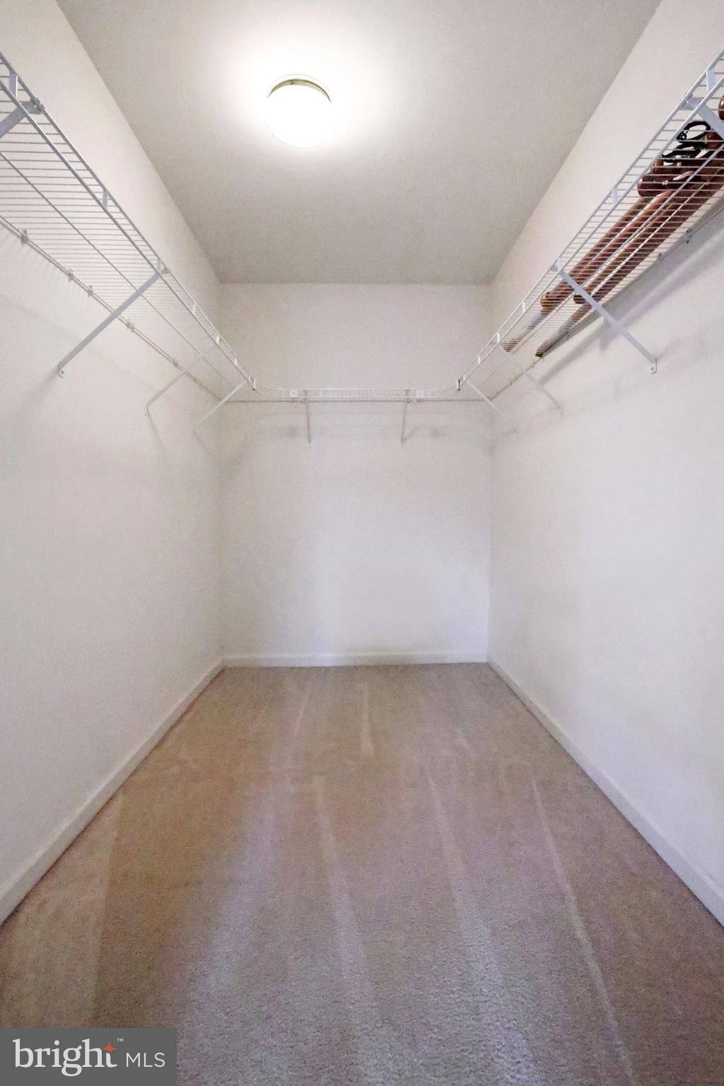 99 Saratoga Road Inwood, WV 25428 - Photo 22 of 34 His and Hers Walk-in-closets