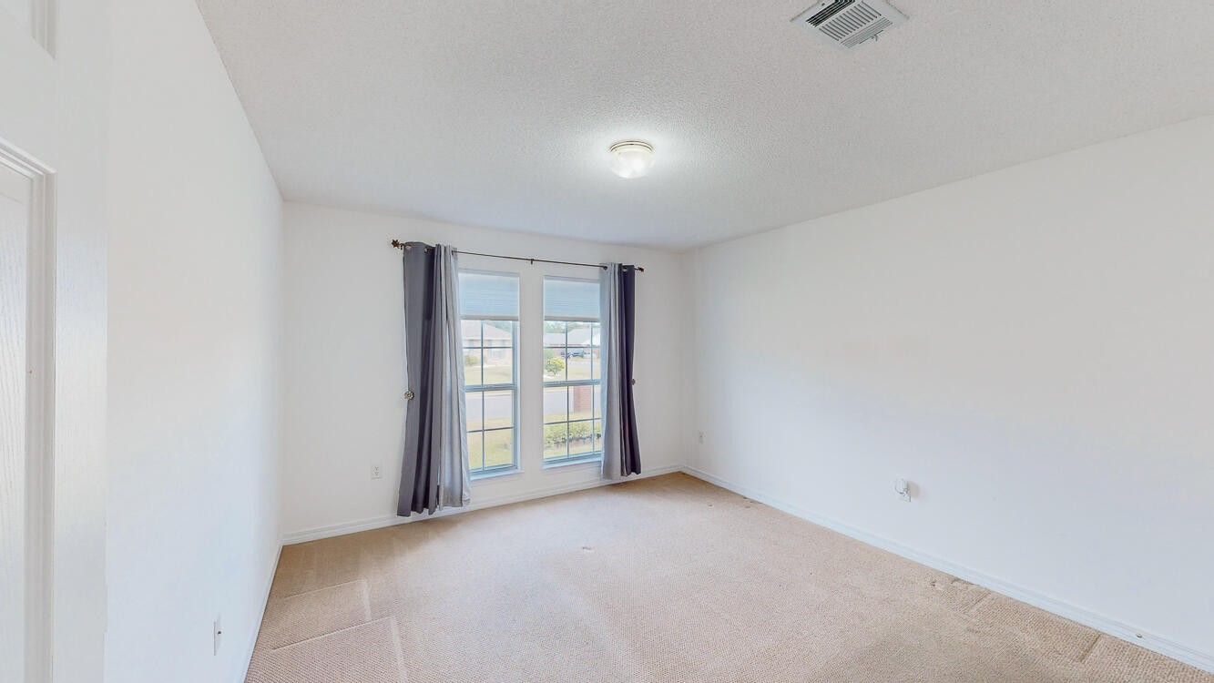 4787 Ribault Lane Milton, FL 32570 - Photo 23 of 36 a view of an empty room with a window