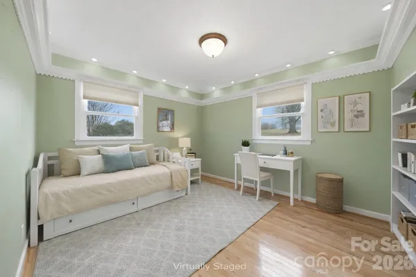 a living room with furniture a table and a window