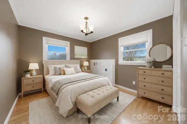 a bed room with a bed and a dresser