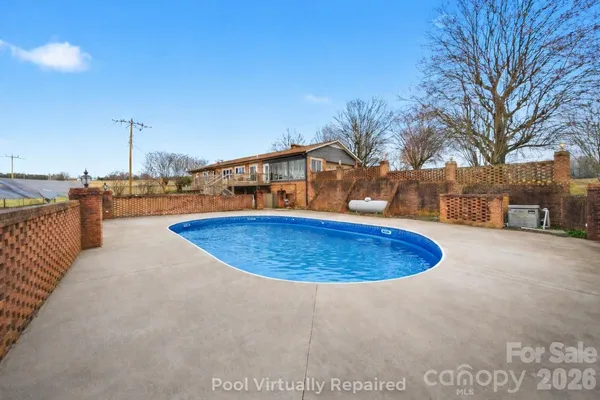 a view of a swimming pool with a patio