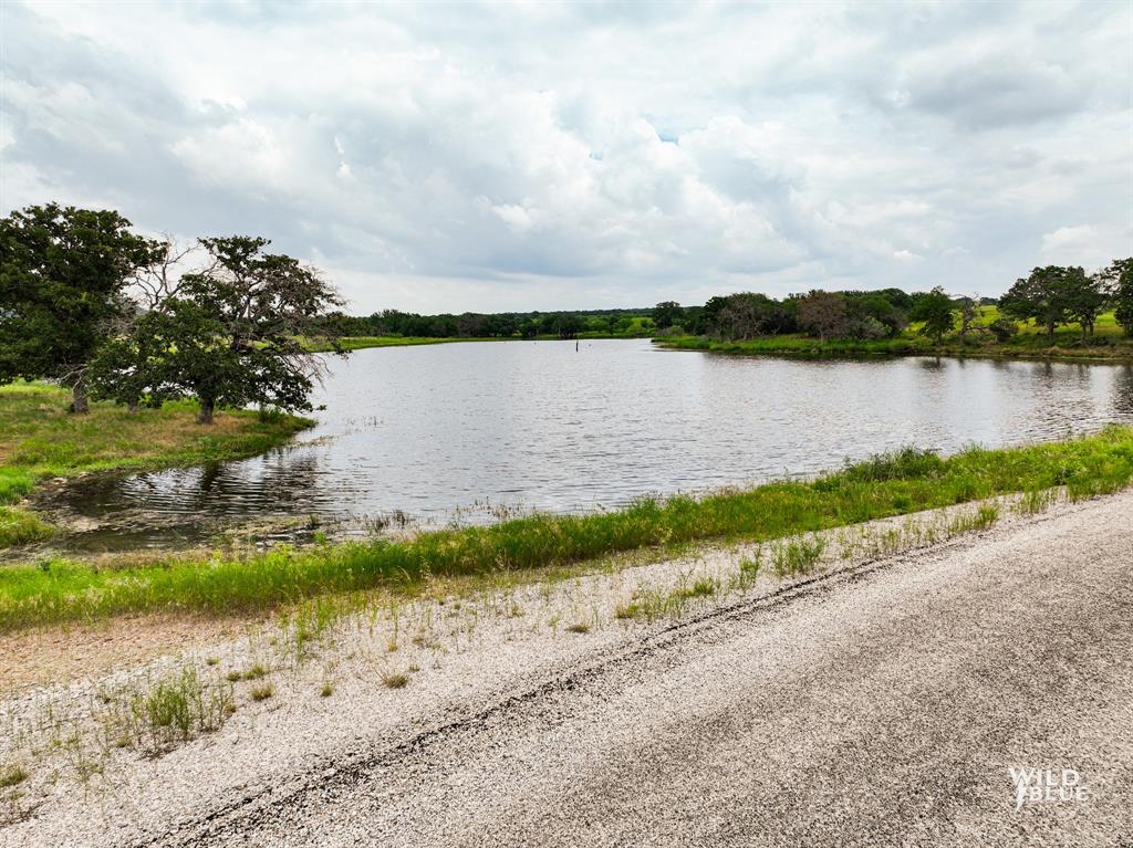 2170 River Shls Road Mineral Wells, TX 76067 - Photo 20 of 40 a view of a lake from a yard
