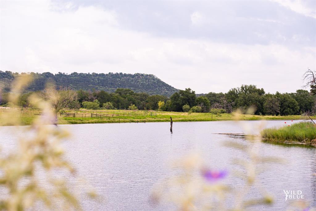 2170 River Shls Road Mineral Wells, TX 76067 - Photo 23 of 40 a view of a lake with a mountain in the background