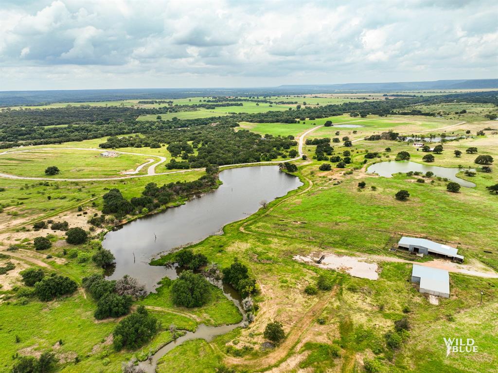 2170 River Shls Road Mineral Wells, TX 76067 - Photo 6 of 40 a view of a lake with a big yard