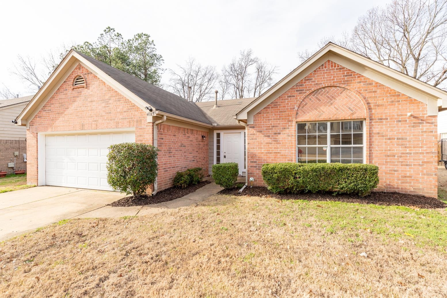 4185 Hampton Manor Lane Memphis, TN 38128 - Photo 1 of 20 a view of a house with a yard