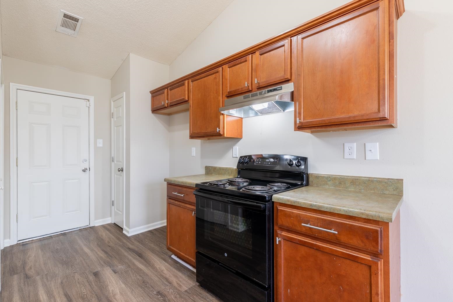 4185 Hampton Manor Lane Memphis, TN 38128 - Photo 13 of 20 a kitchen with stainless steel appliances granite countertop a stove a sink and a microwave