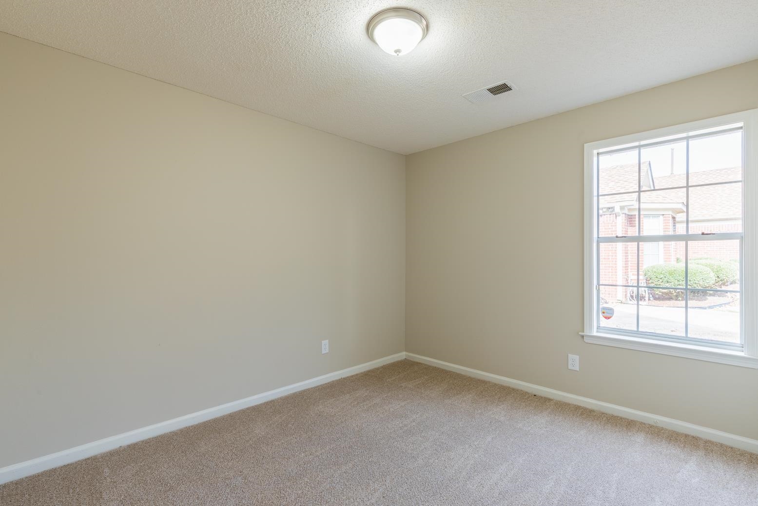 4185 Hampton Manor Lane Memphis, TN 38128 - Photo 19 of 20 an empty room with a window