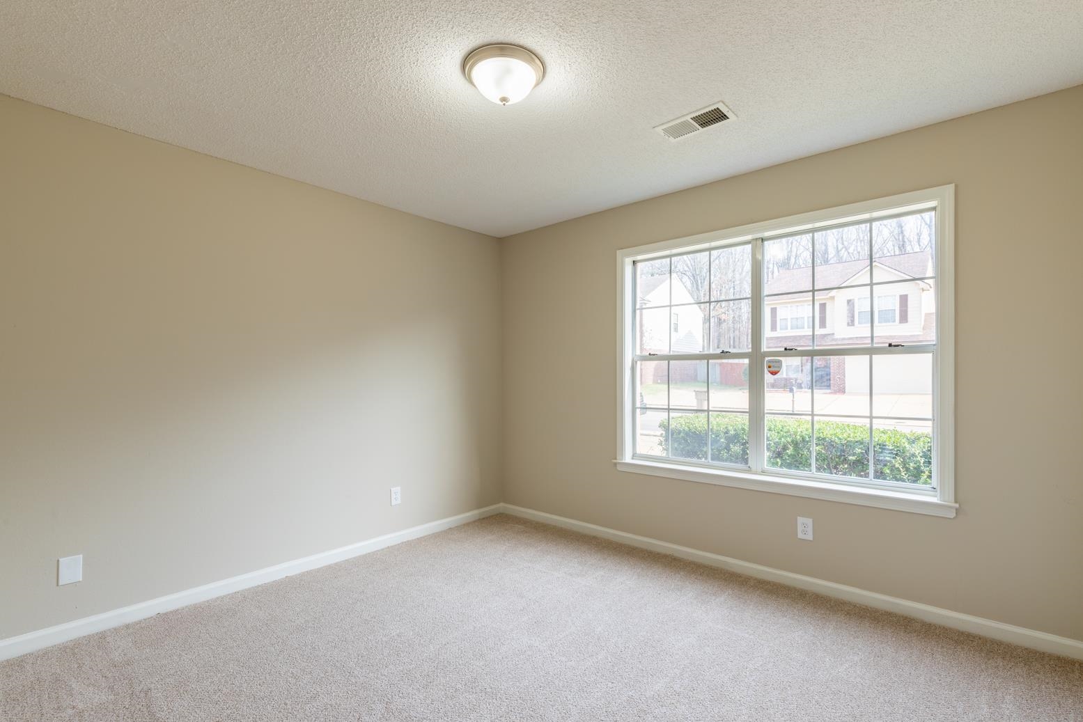 4185 Hampton Manor Lane Memphis, TN 38128 - Photo 20 of 20 an empty room with a window