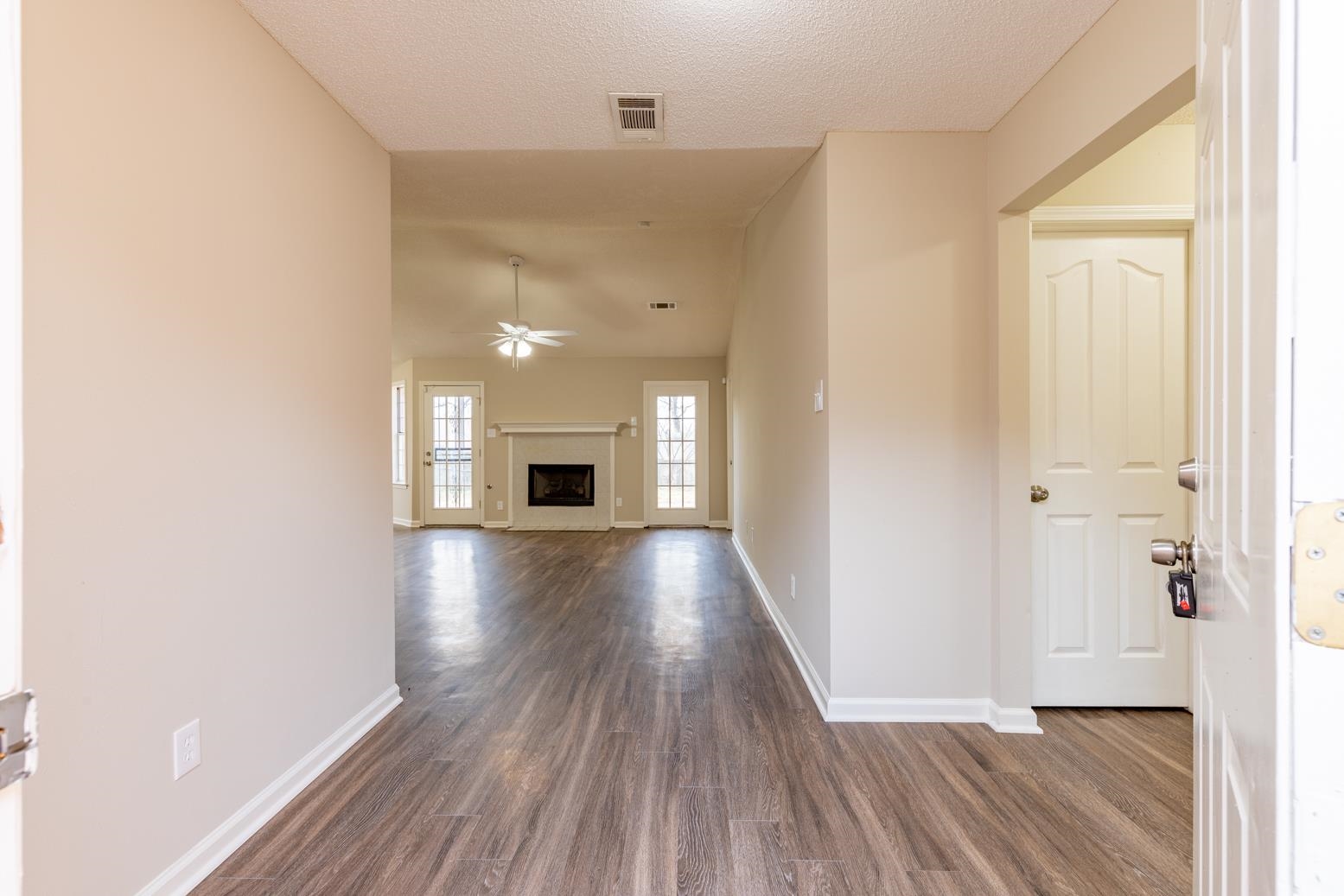 4185 Hampton Manor Lane Memphis, TN 38128 - Photo 6 of 20 a view of livingroom with hardwood floor and a ceiling fan