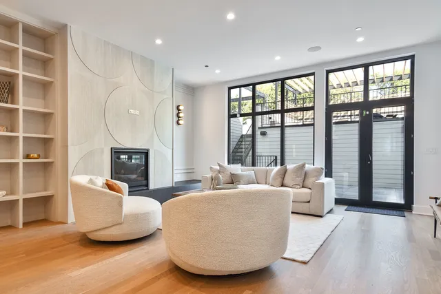 a living room with furniture a rug and a fireplace