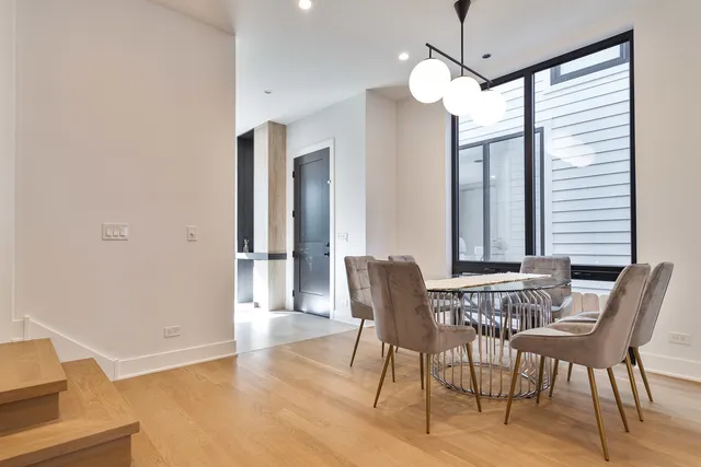 a living room with a mirror and a table