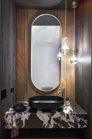 a view of an empty room with wooden floor and city view