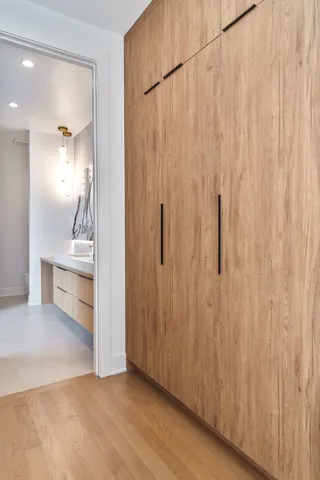 a large tub sitting next to a bathroom sink and a shower