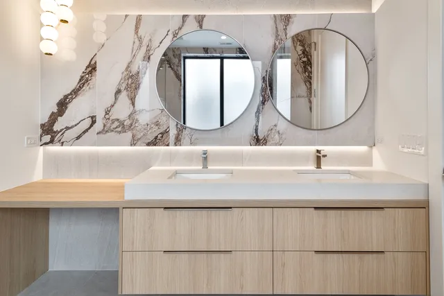 a bathroom with a toilet a sink and shower