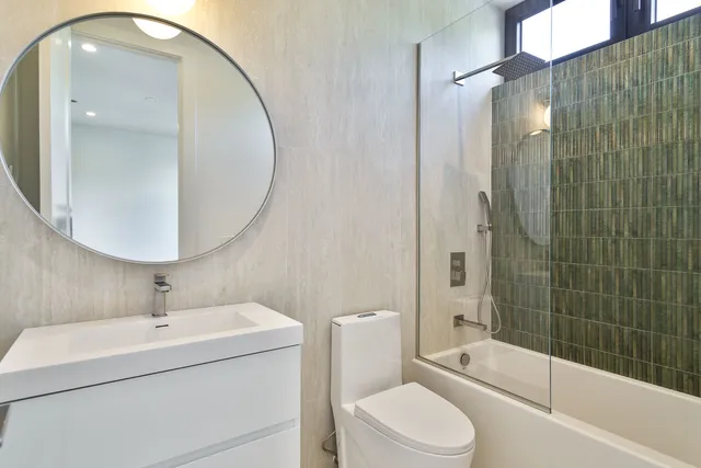 a view of an empty room with a kitchen