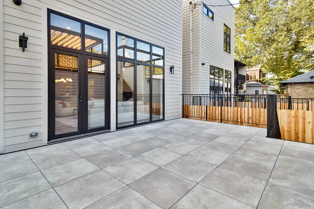 an empty room with a bathroom and a window