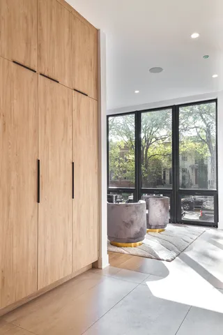 a large white tub sitting in a room next to a window