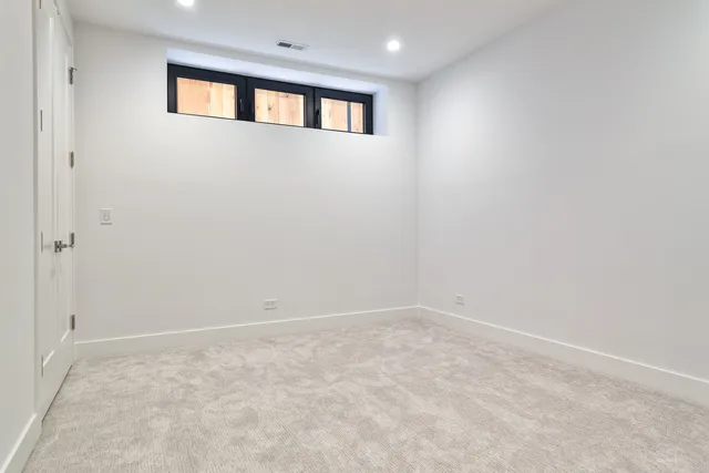 a picture of a bench in front of a wall