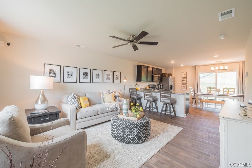 2219 Rdg Ml Way Chester, VA 23831 - Photo 2 of 10 a living room with furniture and a wooden floor