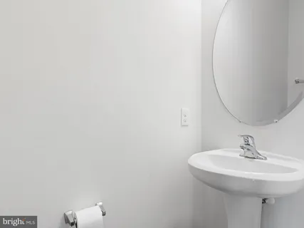 a bathroom with a sink and mirror