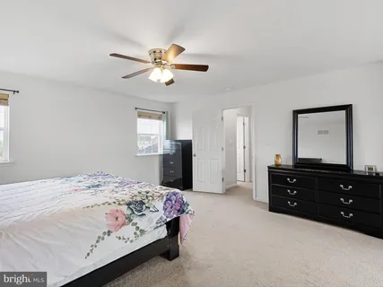 a bedroom with a bed and a dresser