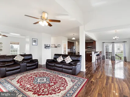 a living room with furniture and a rug