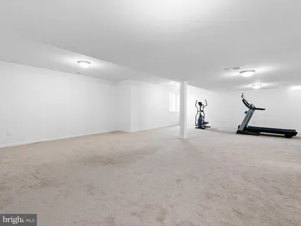 a view of a livingroom and a painting on the wall