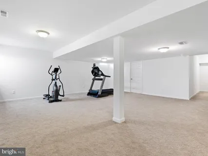 a view of room with gym equipment