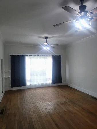 a view of a livingroom with wooden floor
