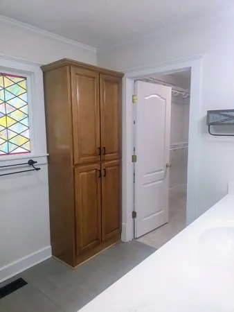 a kitchen with stainless steel appliances granite countertop a sink a stove and a wooden floors