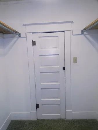 a view of an empty room with windows