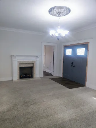 a view of an empty room with a window