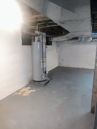 a view of house with yard and garage