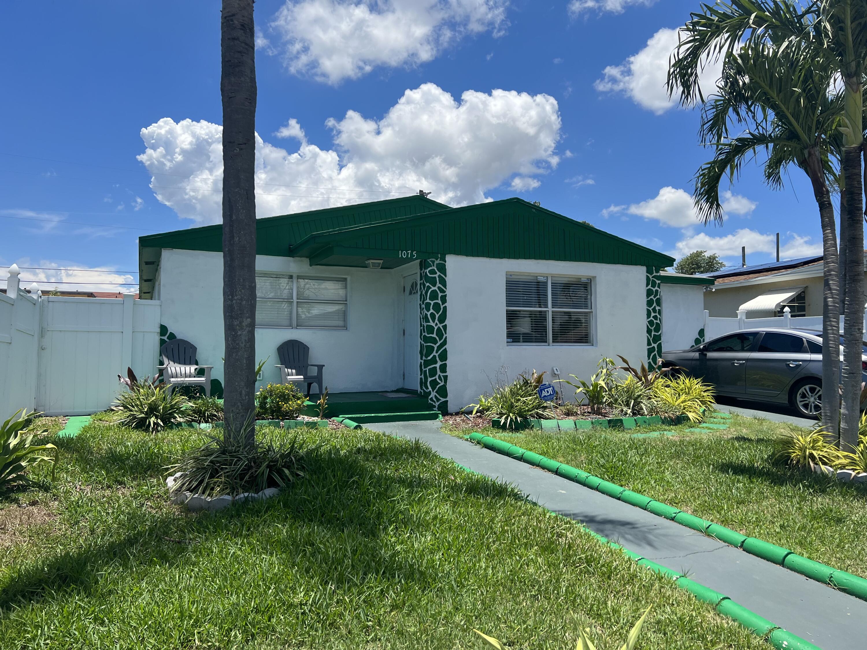 1075 West 26th Street Riviera Beach, FL 33404 - Photo 1 of 18 Front view