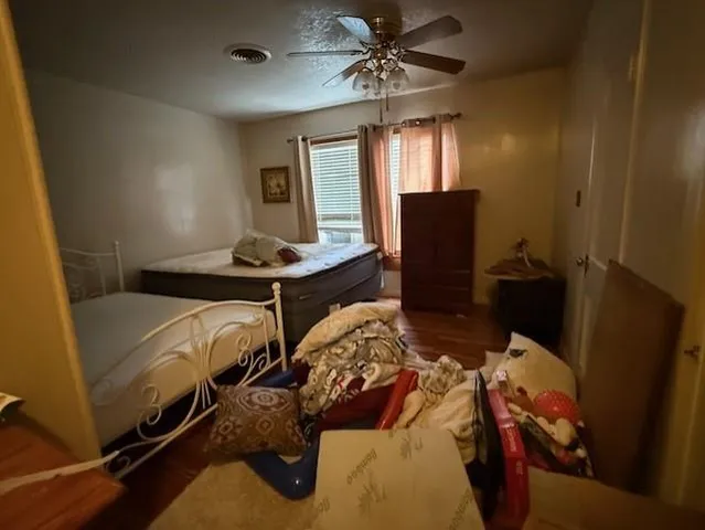 a bed room with a bed and a mirror