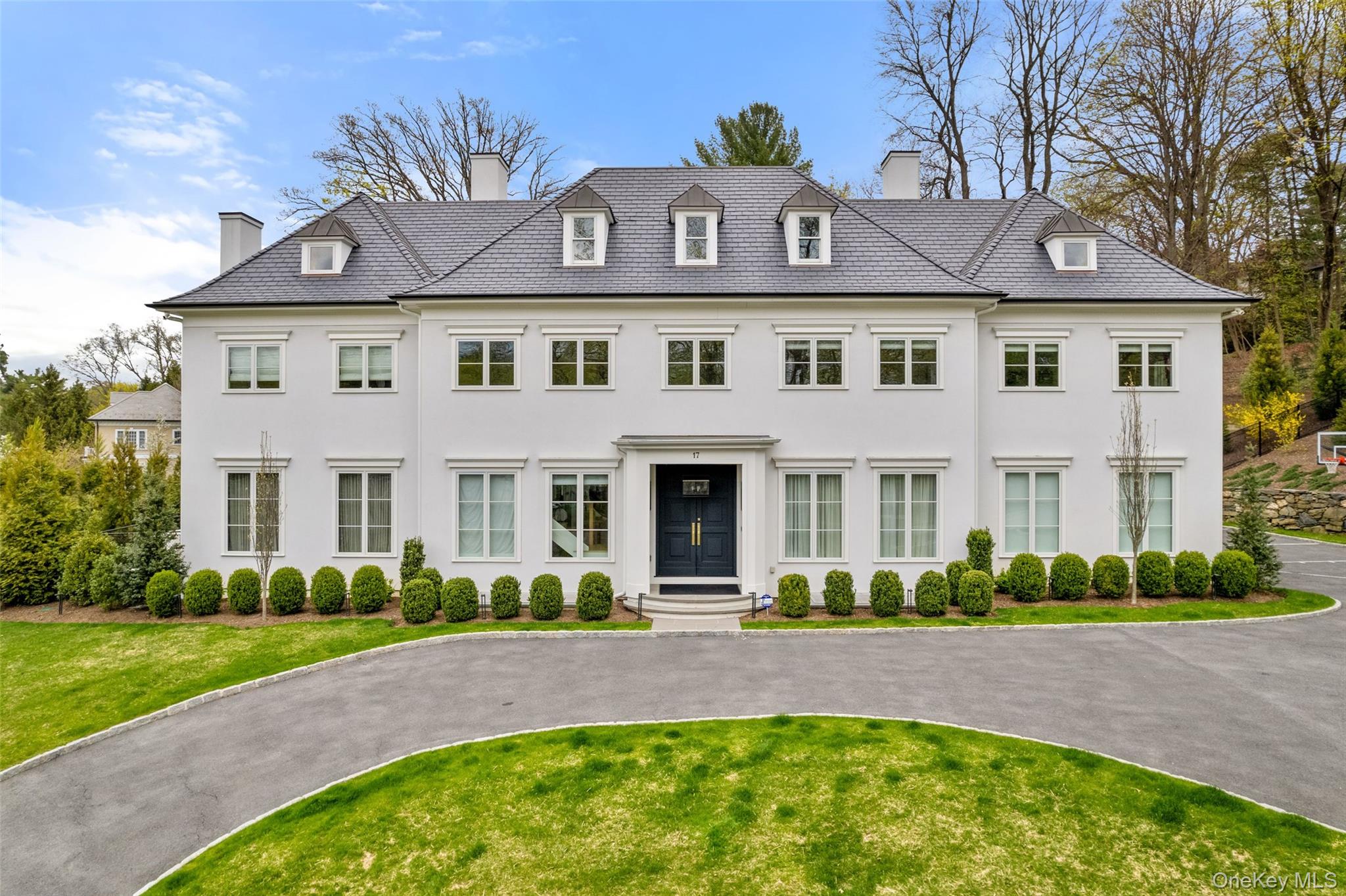 Stately NEW colonial style home on over an acre in estates section of Scarsdale!