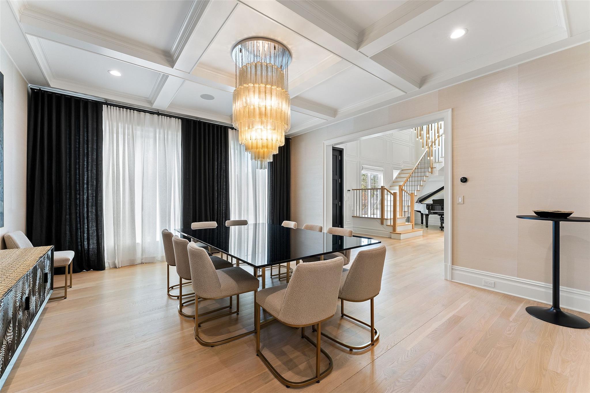 17 Oxford Road Scarsdale, NY 10583 - Photo 16 of 49 a view of a dining room with furniture a chandelier and wooden floor